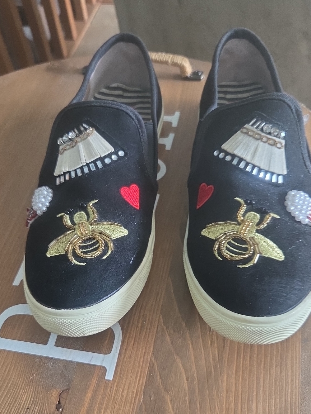 Betsy JohnsBlack Embellished Slip-On Sneakers with Gold Bee and Red Heart Detail